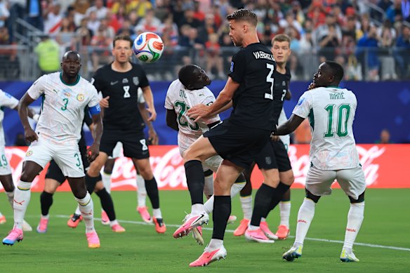 Kristoffer Ajer heads the ball.