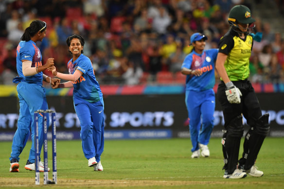 Poonam Yadav sends Jess Jonassen on her way during her spell of 4-19 in Australia's opening match.