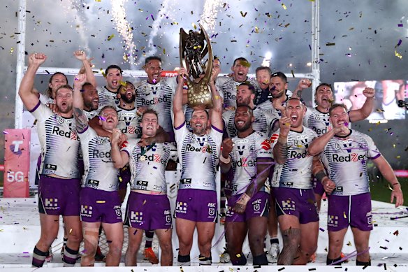 Smith and the Storm celebrate their grand final win over Penrith in October.