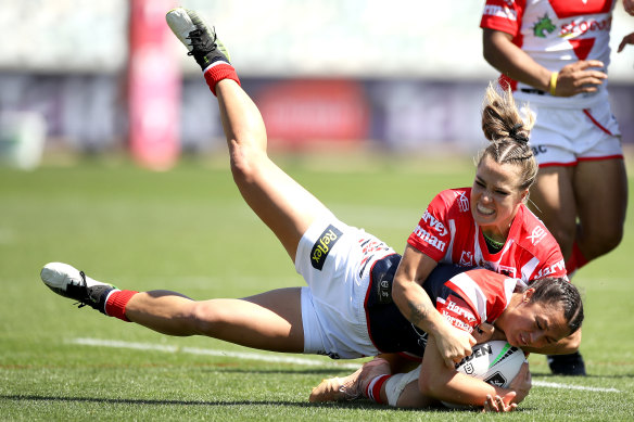 St George Illawarra's Isabelle Kelly brings down Sydney Roosters skipper Corban McGregor.
