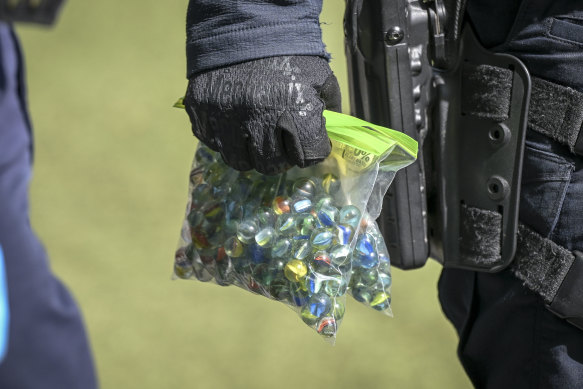 Bags of marbles confiscated by police during a bag search of a protester on the second day of the Land Forces Expo in Southbank on Thursday.