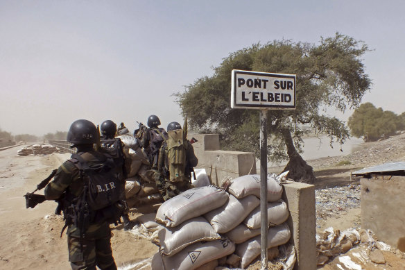 In this 2015 file photo, Cameroon soldiers stand guard at a lookout post as they take part in operations against the Islamic extremists group Boko Haram.