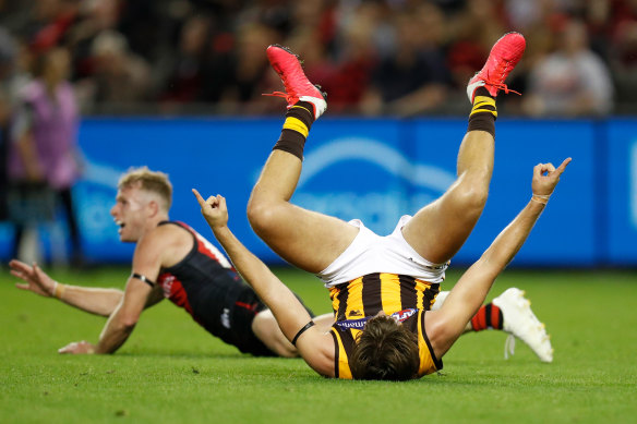 Tom Phillips celebrates a goal for the Hawks in their comeback win over Essendon.