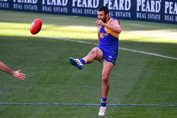 Josh Kennedy kicks for goal.