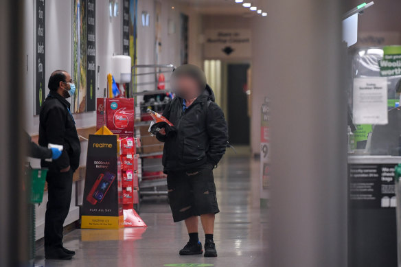 One shopper at the Woolworths in Fitzroy was not wearing a mask on Thursday. 