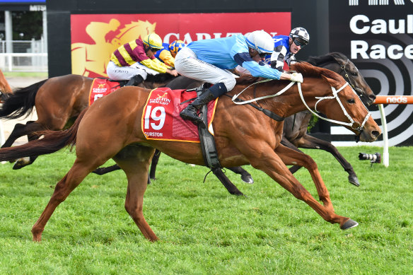 Durston (at the front) stretches to win at the finishing post.