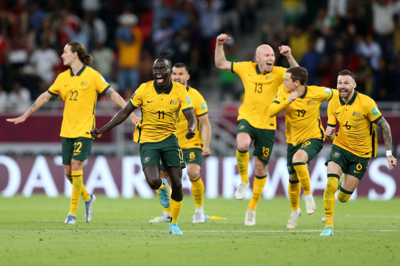 Awer Mabil (11) celebrates the Socceroos’ shoot-out victory over Peru.