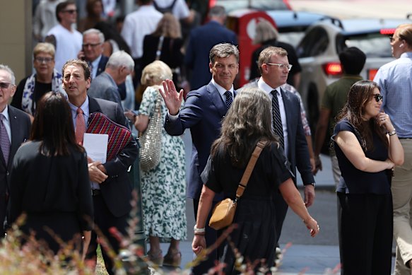 Liberal defence spokesman Angus Taylor  leaving the funeral. 