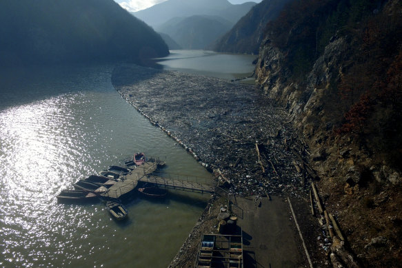 This aerial photo shows plastic bottles, wooden planks, rusty barrels and other garbage clogging the Drina river near the eastern Bosnian town of Visegrad.