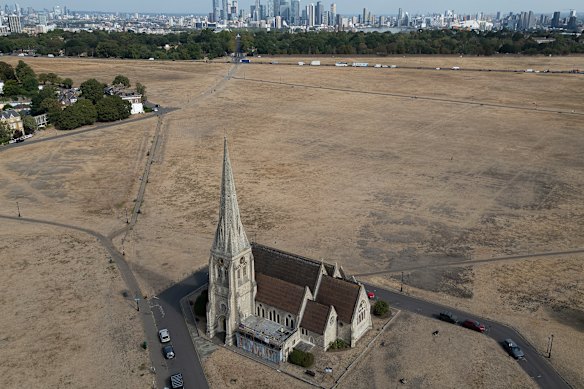 Dried grass surrounds All Saints Church in Blackheath, London.