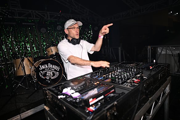 Outgoing Greens leader Adam Bandt in the DJ seat at a fundraiser in Brisbane last month.