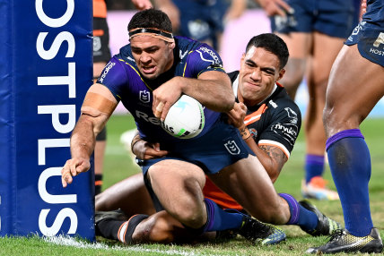 Melbourne forward Dale Finucane crashes over for one of his team’s 12 tries.