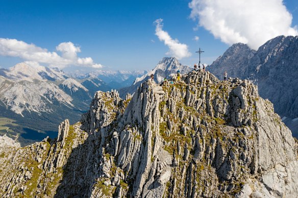 Hikers at the 2450-metre summit of Vorderer Tajakopf, in the Mieming range of mountains, near Innsbruck.