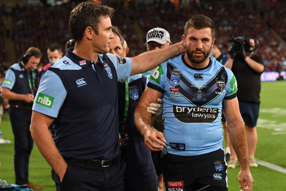 Brad Fittler consoles James Tedesco as he comes from the field with concussion.