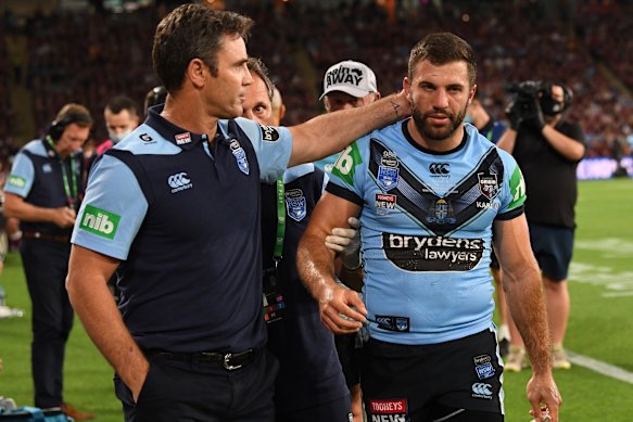 Brad Fittler consoles James Tedesco as he comes from the field with concussion.