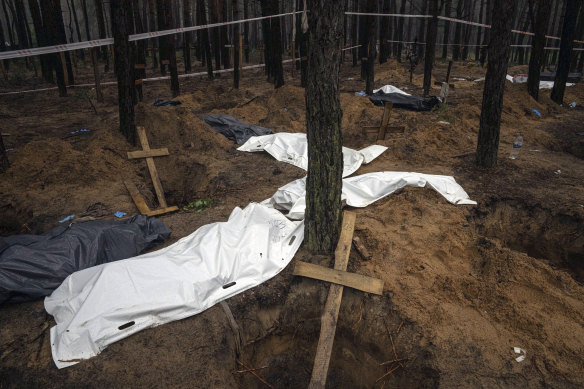 Bags with dead bodies are seen during the exhumation in the recently retaken area of Izium.