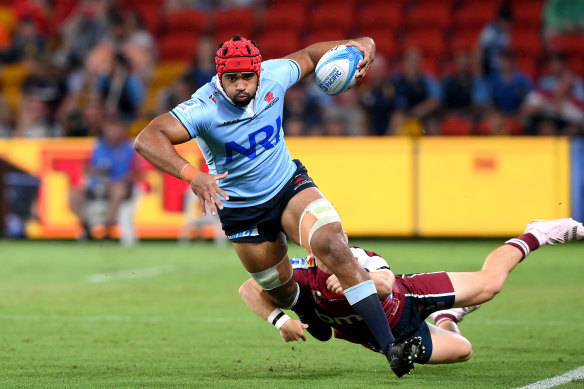 Waratah Langi Gleeson is tackled during the clash against the Reds in Brisbane.