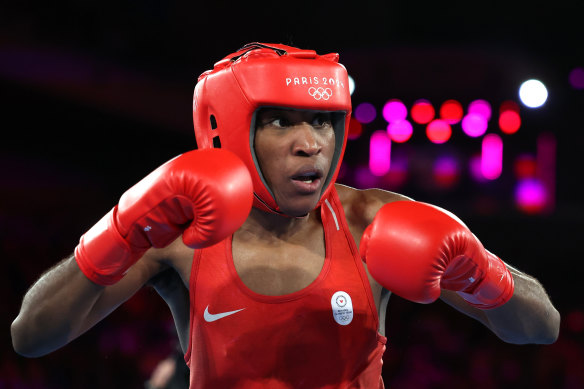 Cindy Ngamba has become the first person to win a medal while competing with the Olympic refugee team. 