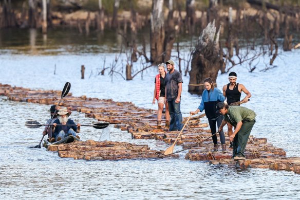 A dozen strangers are tasked with building a bridge, using rudimentary tools, rope and large timber logs. But only one of the group can cross the bridge to retrieve $250,000 in a trunk.