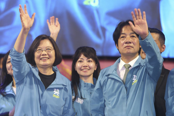 Taiwanese President Tsai Ing-wen, left, waves to supporters while launching her re-election campaign in Taipei in November.