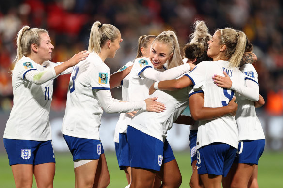 Lauren James of England celebrates with teammates during their win over China.