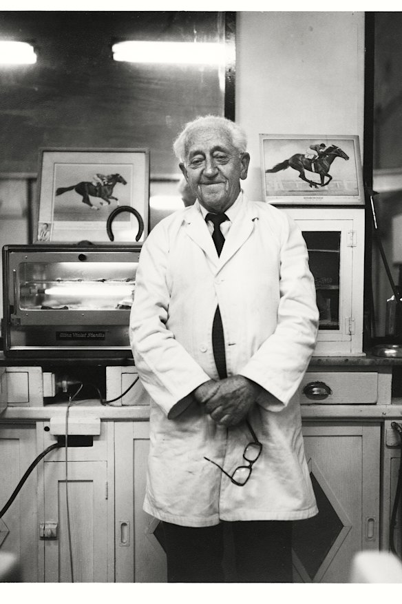 Mr Lindsay Williams at his barber and tobacconist shop, Errol Street, North Melbourne, c. 1982. 