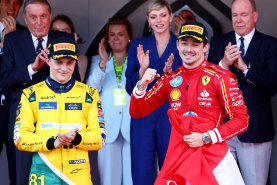 Race winner Charles Leclerc (right) and the second-placed Oscar Piastri celebrate on the famed Monaco podium.