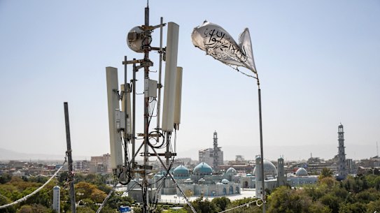 A Taliban flag fluttering near telecom equipment installed over a rooftop providing internet services overlooking Hazrat-e-Ali Shrine, or Blue Mosque, in Mazar-i-Sharif, last month.