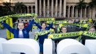 School students pose for a celebratory photo at an Olympics breakfast event at King George Square on Wednesday ahead of the IOC announcement.