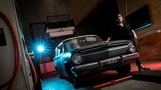EVolution Australia's Emma Sutcliffe with her 1963 EJ Holden wagon, which is currently being converted to electric.