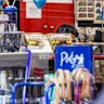 A tobacconist is seen peeking from a counter on Macquarie street, Sydney,