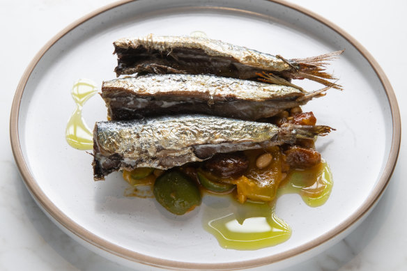 Meaty sardines are plated with a sweet agrodolce, pine nuts and green olives.