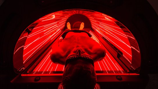 Naum Sekulovski inside a red light therapy bed at P3 Recovery Centre in Richmond.