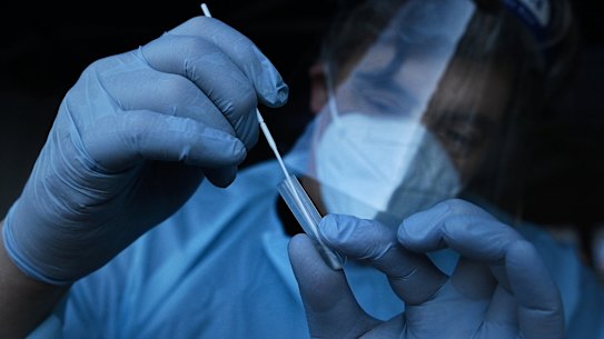 A Sydney doctor conducts a COVID-19 rapid antigen test in 2021.