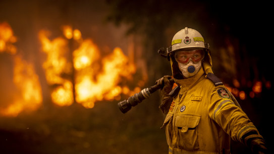 A Rural Fire Service volunteer works at Bawley Point