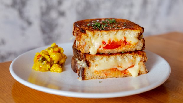 Three-cheese toastie with warrigal greens, kimchi and tomato.