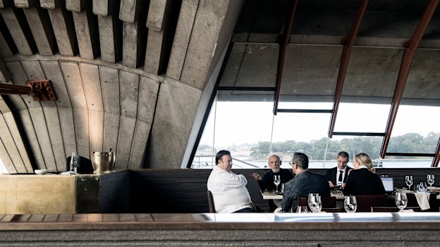 Fink Group owner Leon Fink (second from left) tastes Quay’s new menu with a group including its executive chef Peter Gilmore (left) at sister venue, the Opera House’s Bennelong.