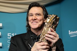 Jim Carrey poses after receiving the Cesar of Honour award during the 51th Cesar Awards ceremony in Paris.