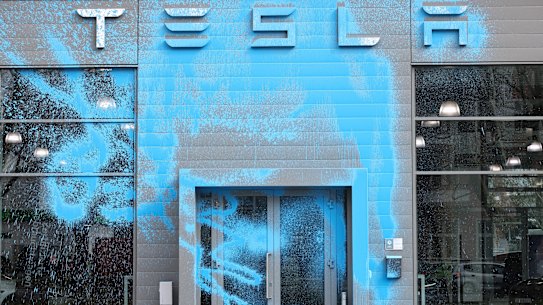 A Tesla car dealership in Berlin doused in blue paint in March.