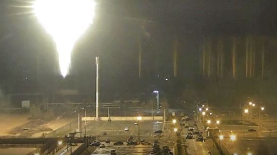 This image from a video released by the Zaporizhzhia nuclear power plant in Ukraine shows a bright flaring object landing in the grounds of the complex in March 2022.