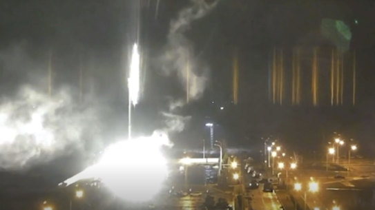 An image from a video released by Zaporizhzhia nuclear power plant shows a bright flaring object landing in grounds of the nuclear complex in Enerhodar, Ukraine, before dawn on Friday.