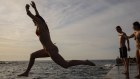 Swimmers at Clovelly getting an early start on what is forecast to be a record hot October day.