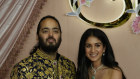 Anant Ambani and Radhika Merchant pose for photographers during their pre-wedding ceremony in Mumbai.