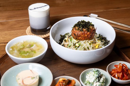 Yukhoe (raw beef) with seaweed, sprouts, rice and sides.