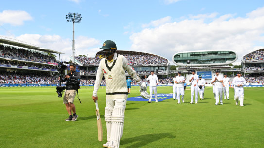 England’s players follow Nathan Lyon off the field at the end of Australia’s innings.