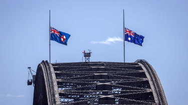 Flags fly at half-mast on the Sydney Harbour Bridge following Prince Philip’s death. 