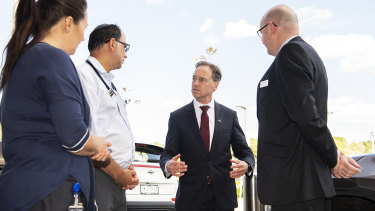 Health Minister Greg Hunt with medical experts on Sunday. 