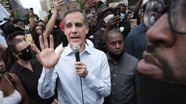 Los Angeles Mayor Eric Garcetti has committed to cutting the LAPD budget