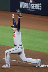 Freddie Freeman celebrates recording the final out at first base.
