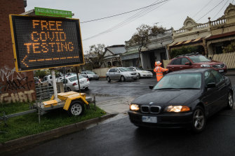 Cars enter a pop-up testing clinic in Brunswick.  